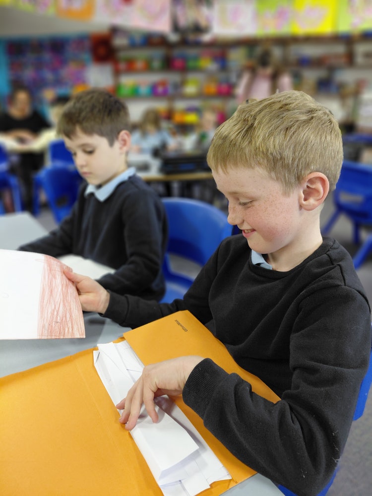 Student looking through folder