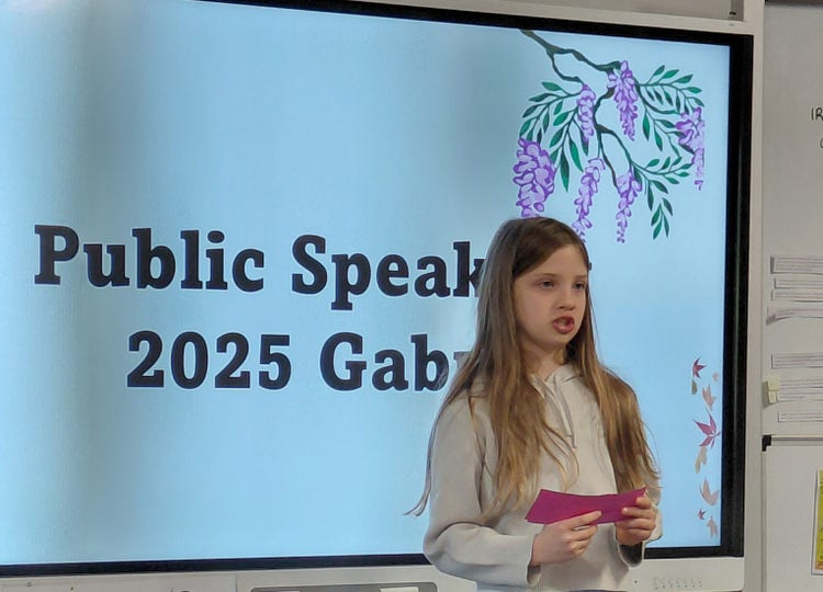Student performing speech at our annual public speaking event.